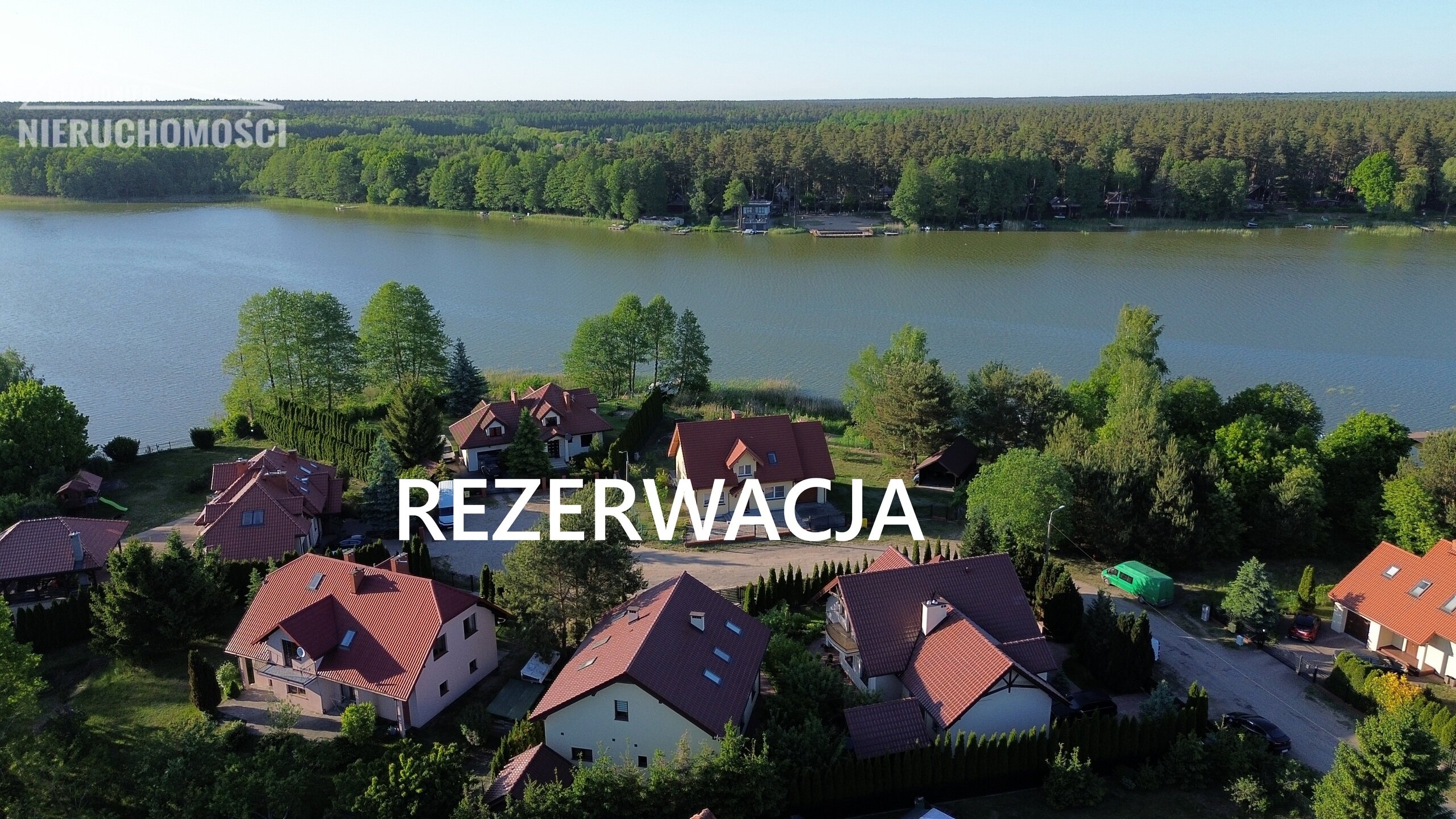 Mazury - Ostróda, dwa budynki mieszkalne nad jeziorem Pauzeńskim, własny pomost - zdjęcie 1