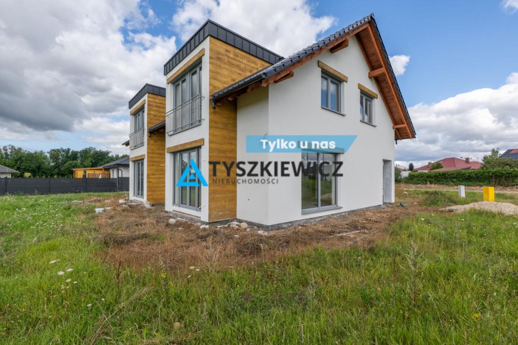 Dom w zabudowie bliźniaczej z ogrodem | garaż - zdjęcie 1